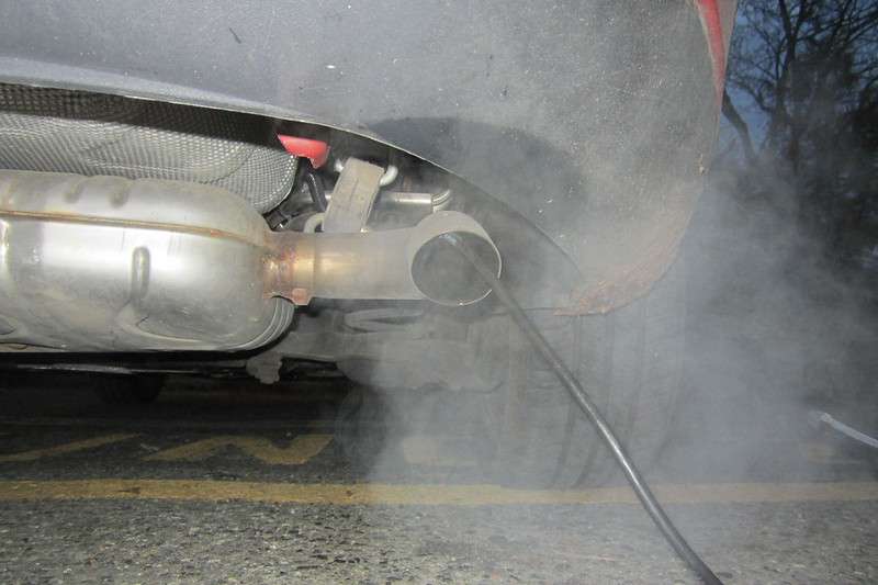 Picture of a car emitting smoke from exhaust