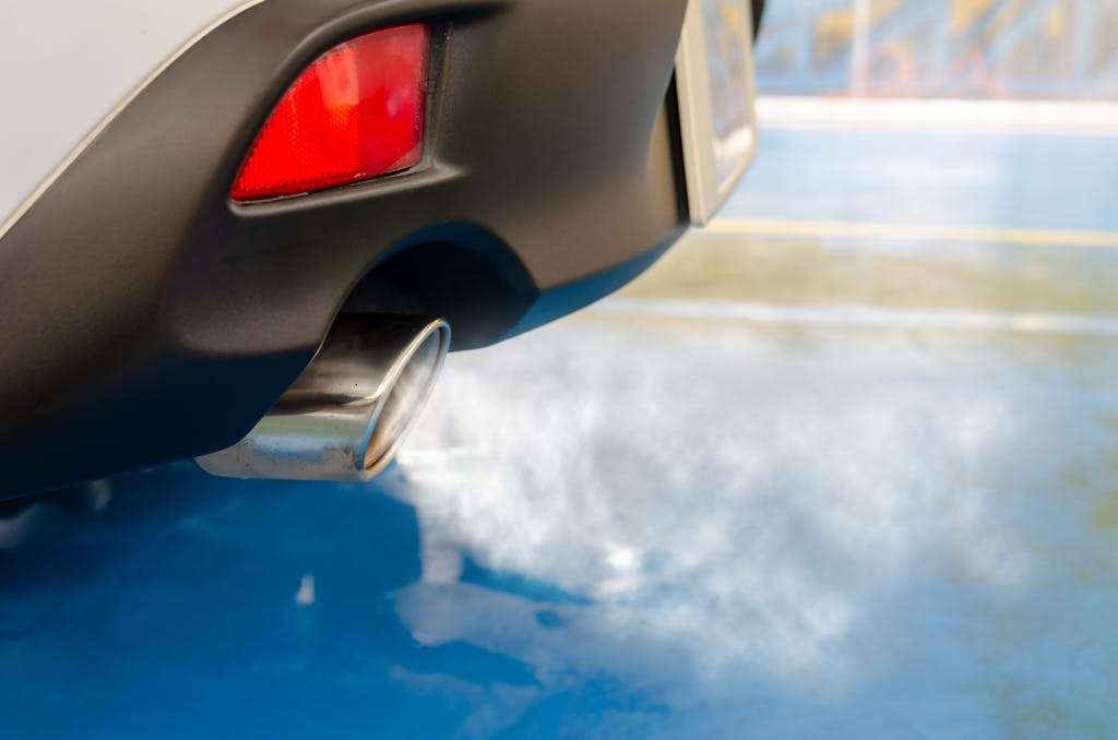 Picture of a car emitting smoke from exhaust